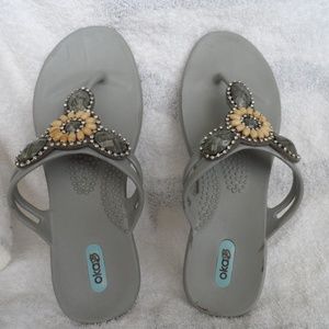 Gray bejeweled jelly flip flops size M from okaB